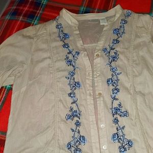 Erika tan bouse w blue embellishments.